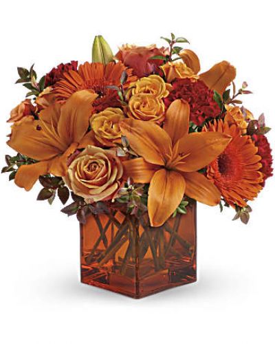 <div id="mark-3" class="m-pdp-tabs-marketing-description">Celebrate the wonder of a new day with warm, golden flowers. A modern orange glass vase is the foundation of this stunning, sun-bright bouquet that energizes any occasion.</div>
<p><del> </del></p>
<p> </p>
<ul>
<li>Orange gerbera daisies, orange roses and red mini carnations are accented with a spray of red huckleberry in an orange cube</li>
</ul>
<div id="desc-3">
<ul>
<li>vase.</li>
</ul>
</div>
<p> </p>
<ul>
<li></li>
</ul>
<p> </p>